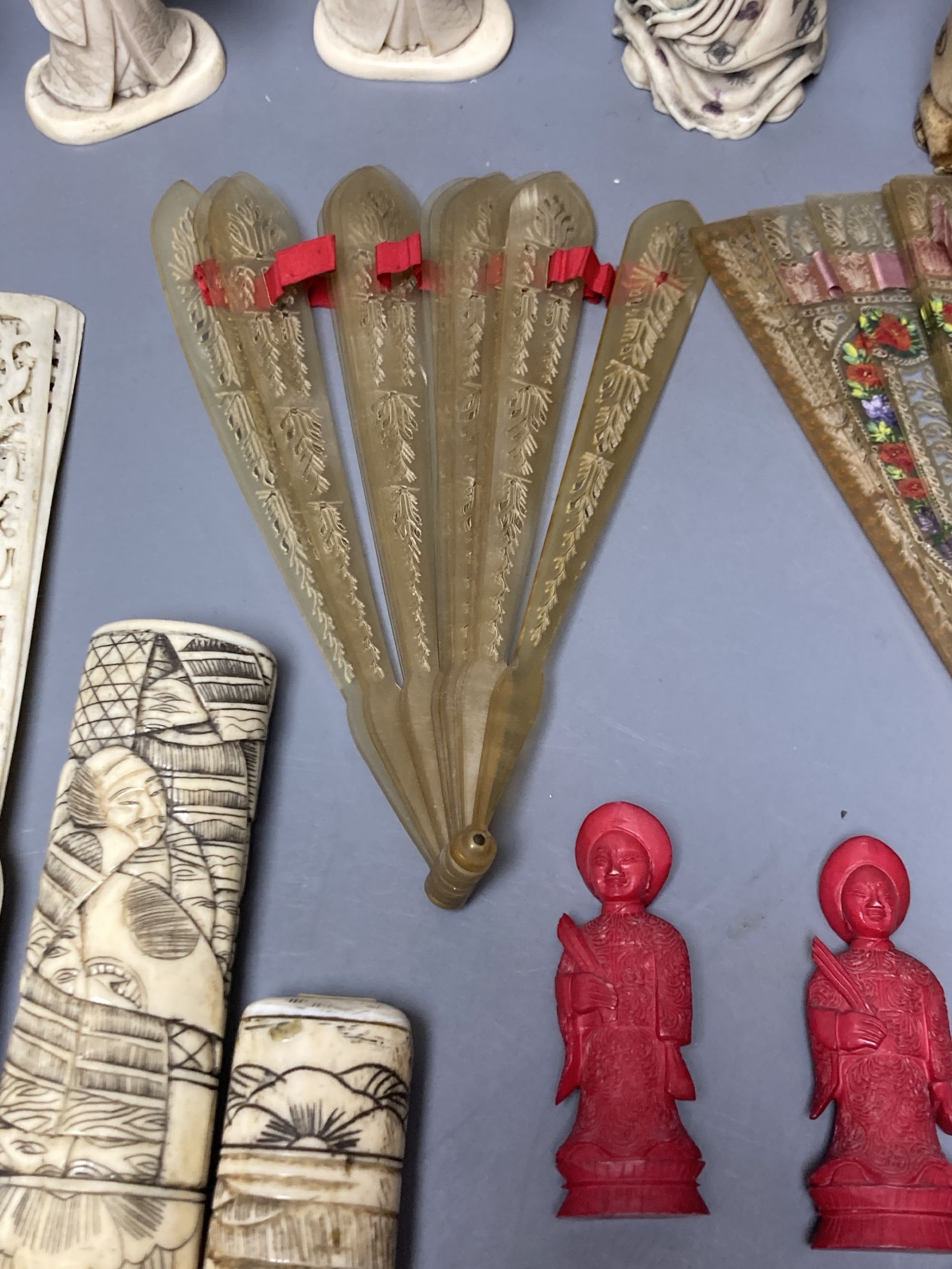 A quantity of bone and ivory carvings including fans and figures